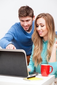 Young couple working with laptop