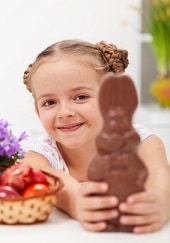Happy easter girl with chocolate bunny