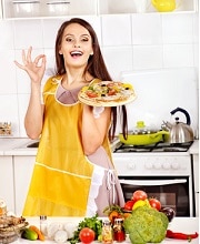 Woman cooking pizza.