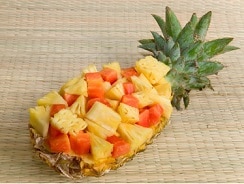 Fresh cut pineapple served in a natural bowl