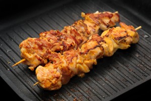 preparation of chicken shish kebab on skewers