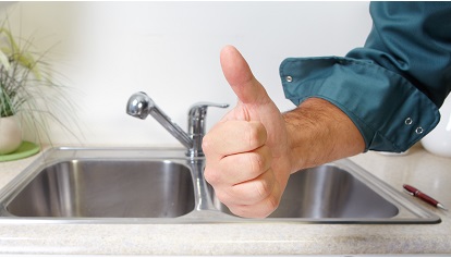 Plumber on the kitchen. Renovation  and plumbing.